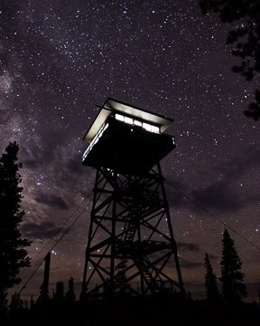 Fire tower camping night view with stars