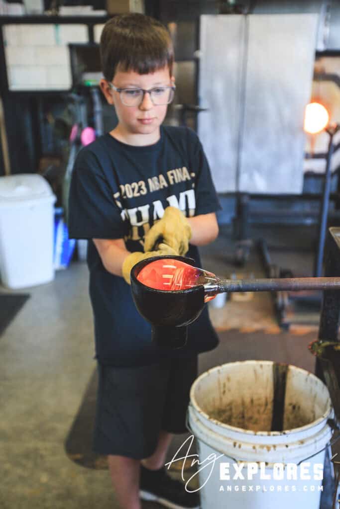 Using a block to shape a glass paperweight