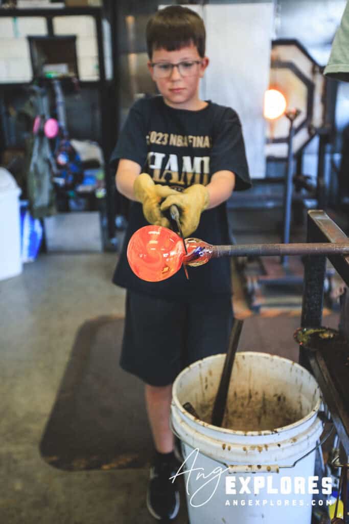 using tools in the glass blowing class