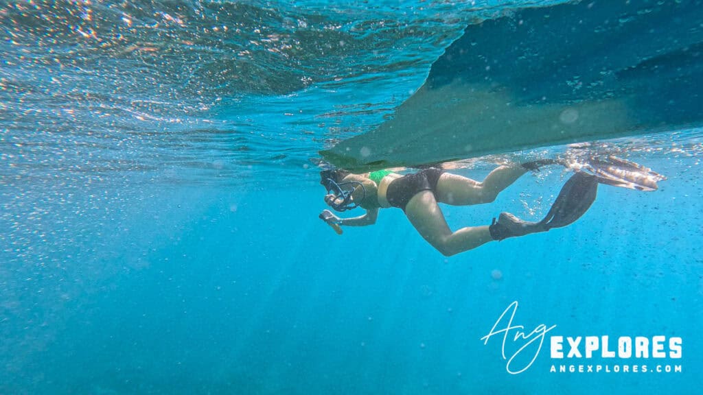 snorkeler towing kayak
